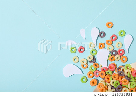 Colorful cornflakes, concept of tasty breakfast, morning food, space for text 126736931