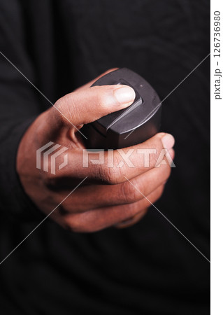 hand holding a body spray closeup hand holding a body spray closeup 126736980