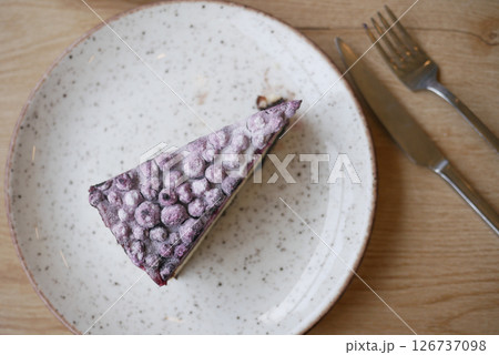 Delicious berry cake served on a rustic dinner plate Delicious berry cake served on a rustic dinner plate 126737098