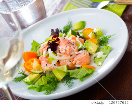 Ceviche of salmon with avocado, kumquat and dill 126737633