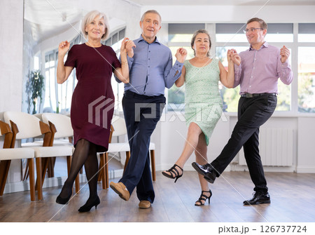 Group of men and women dancing folk dance Group of men and women dancing folk dance 126737724