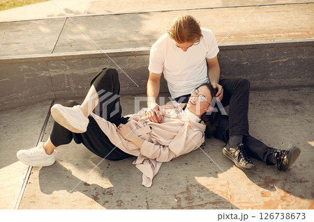 Couple in a summer park. Man in a white t-shirt. Couple in a summer park. Man in a white t-shirt. 126738673
