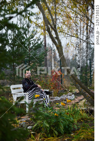 A Contemplative Moment in the Vibrant Autumn Garden of the Urban Backyard, Beauty Awaits 126738815