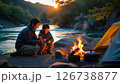 家族で川原でキャンプをしている様子 126738877