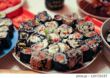 table with a set of rolls and sauce table with a set of rolls and sauce 126739187