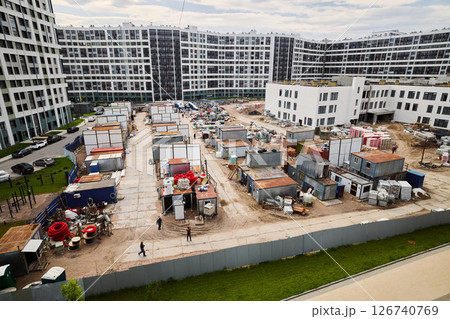 Urban construction site showcasing modern buildings that are currently in the development phase 126740769