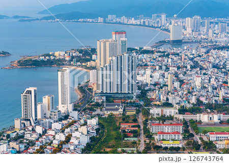 Panorama of Nha Trang city in Vietnam aerial top view. Skyscrapers by sea in a resort town in Asia above of drone 126743764