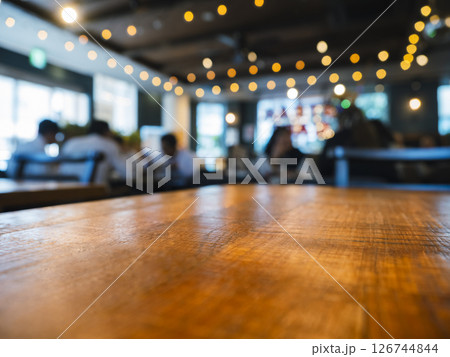 Table top wooden counter Bar with people Cafe restaurant interior Blur background Table top wooden counter Bar with people Cafe restaurant interior Blur background 126744844