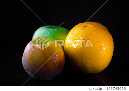 fruit on a black background fruit on a black background 126745936