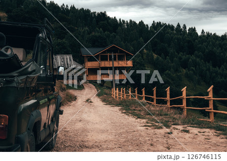 Wooden Fence Overlooking a Serene Mountain Valley Wooden Fence Overlooking a Serene Mountain Valley 126746115