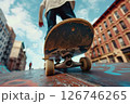 Skilled maneuver. Man rides longboard in squat position, bottom view. 126746265