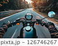 Biker rides on road. First-person view. 126746267