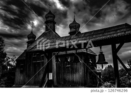 A Historic Wooden Church Stands Majestically Under Dramatic, EverChanging Skies Above A Historic Wooden Church Stands Majestically Under Dramatic, EverChanging Skies Above 126746296
