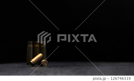 Minimalistic composition emphasizing military and dramatic elements with a focus on weaponry. Minimalistic composition emphasizing military and dramatic elements with a focus on weaponry. 126746319