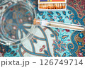 Twisted marijuana cigarette in a special flask 126749714