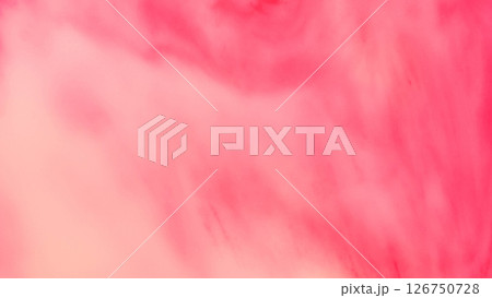 Dreamy red-pink abstract wash. The image fades gently from coral to rose hues with soft, cloudy textures. ideal as a romantic, calming background. 126750728