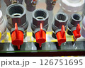 A Wide Variety of Plumbing Valves Featuring Distinctive Red Handles for Easy Identification 126751695