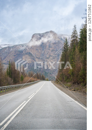 Mountain road and valley of Chuysky Trakt Altai Russia. Scenic route through rugged terrain and expansive natural landscape 126751862