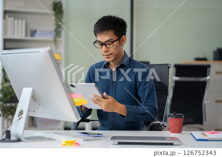 Male businessman are sitting searching for information in office. Male businessman are sitting searching for information in office. 126752343