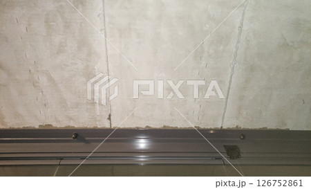 Concrete ceiling panels showing marks and a metal railing in prague 126752861