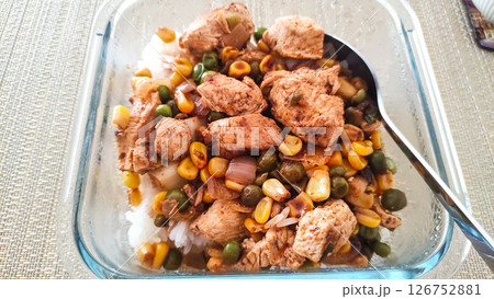 Chicken breast with rice, peas, corn and mushrooms in glass casserole dish 126752881