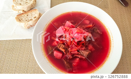 Steaming borscht with beef and bread in prague restaurant 126752888