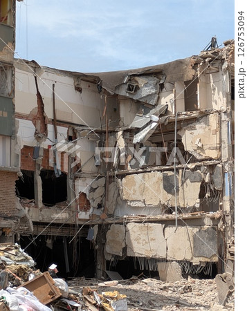 Demolition of Shopping centre Offices by an Industrial Grab Crusher Hydraulic Excavator Demolition of Shopping centre Offices by an Industrial Grab Crusher Hydraulic Excavator 126753094