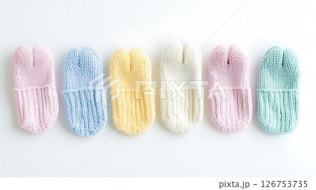 A row of knitted socks in various colors 126753735