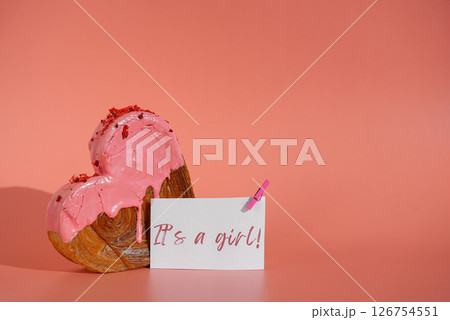 It's a girl saying gender party celebration Heart shaped strawberry berry croissant on pink background with copy space. Puff pastry new trendy sweet dessert bakery. Creamy dough 126754551