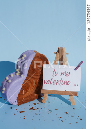 Valentine's Day TO MY VALENTINE wishes saying caption on greeting card Delightful heartshaped pastry croissant treat, beautifully topped with colorful frosting galore. Copy space. Food experimentation 126754567