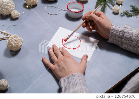 Christmas ball Storytelling of creating craft Christmas greeting card holiday present. Tactile hand-on activity. Master class progress of creative me-made gifts. Seasonal domestic life micro moment 126754670