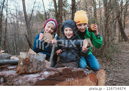 Children Playing in Forest with Wood Pieces 126754874