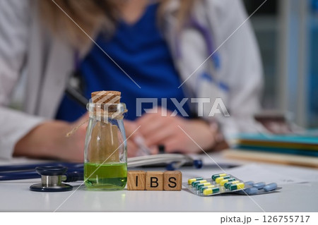 Consultation for IBS treatment involves the use of medication alongside various doctors tools Consultation for IBS treatment involves the use of medication alongside various doctors tools 126755717