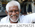 A Joyful Elderly Man Smiling Happily While Enjoying the Outdoors on a Beautiful Day 126756725