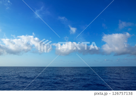cumulus clouds in blue sky over water horizon cumulus clouds in blue sky over water horizon 126757138