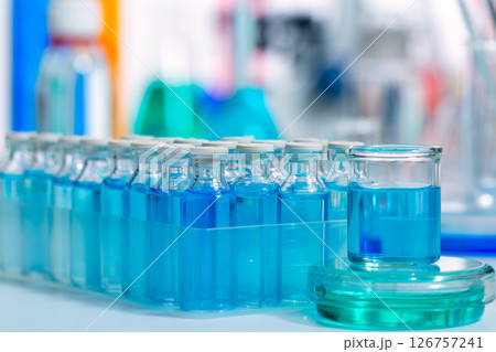 Chemical scientific laboratory blue glass bottles 126757241