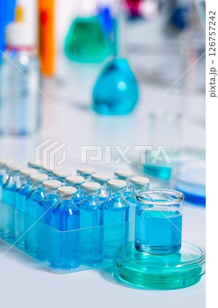 Chemical scientific laboratory blue glass bottles 126757242