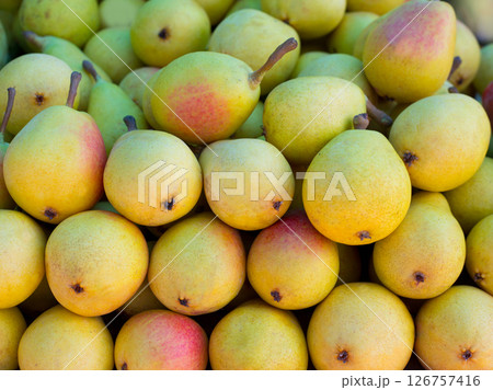 pears fruits stacked in a row on market pears fruits stacked in a row on market 126757416
