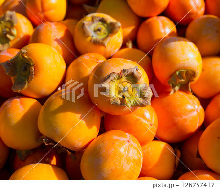 Persimmon ripe fruits pattern in market Persimmon ripe fruits pattern in market 126757417