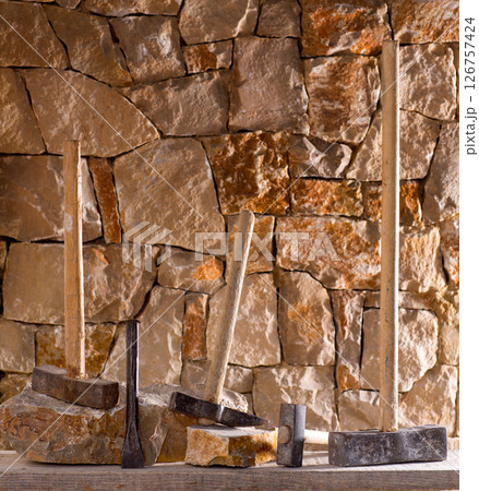 Hammer tools of stonecutter masonry work 126757424
