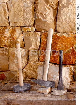 Hammer tools of stonecutter masonry work 126757428
