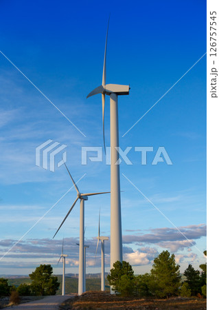 windmills green electric energy in pine mountain blue sky 126757545