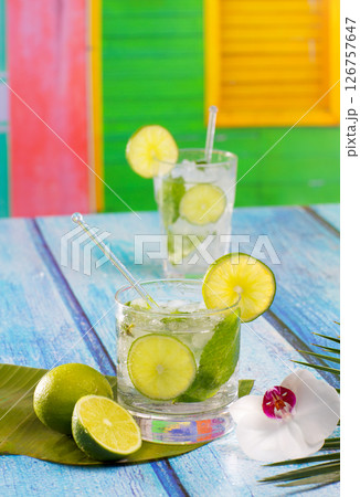 Cuban Mojito cocktail in tropical blue wood flowers and starfish Cuban Mojito cocktail in tropical blue wood flowers and starfish 126757647