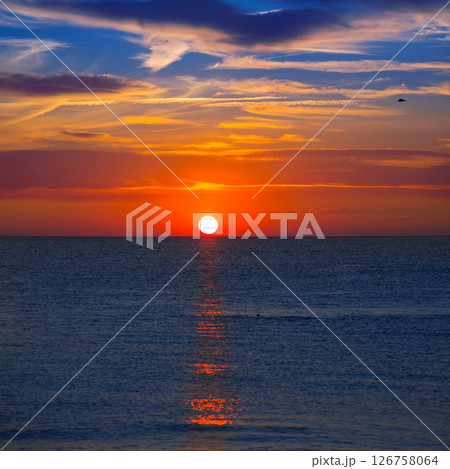 Sunset at Mediterranean sea with orange sky Sunset at Mediterranean sea with orange sky 126758064