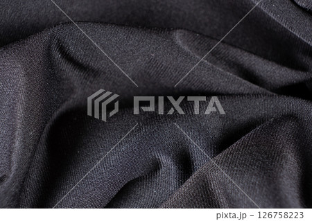Old worn-out polyester and elastane fabric, pilling and frayed threads 126758223