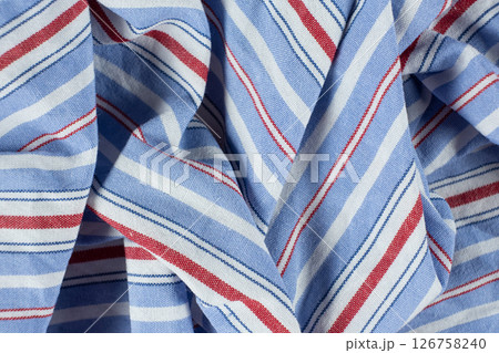 Macro texture of a fabric consisting of one hundred percent cotton. Macro texture of a fabric consisting of one hundred percent cotton. 126758240