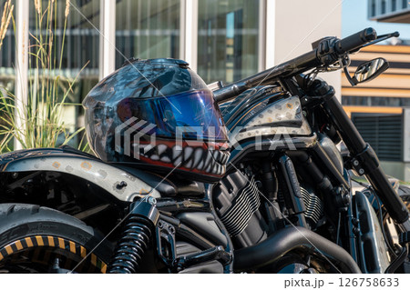 Cool motorbike with helmet on the seat of motorcycle the city. High quality photo 126758633