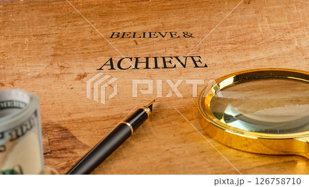 Inspiration quotes concept. BELIEVE and ACHIEVE words Inspiration quotes concept. BELIEVE and ACHIEVE words 126758710