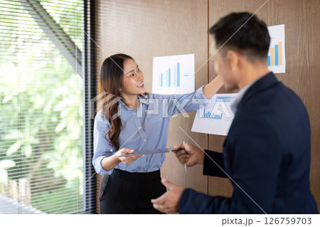 Presenting Data Insights. Professional explaining project results to colleague. 126759703