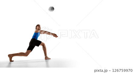 Volleyball athlete stretches arms forward in deep lunge pose while preparing to bump volleyball in motion against white studio background Volleyball athlete stretches arms forward in deep lunge pose while preparing to bump volleyball in motion against white studio background 126759970